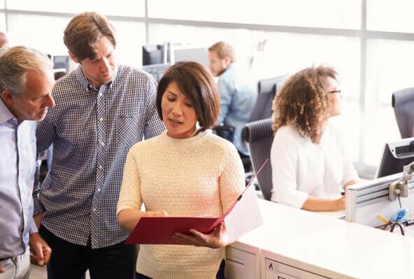 Professionals reviewing how to build business plan for medical practice