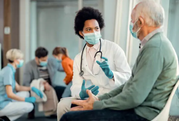 Medical professional works with patients amid staffing shortages in healthcare