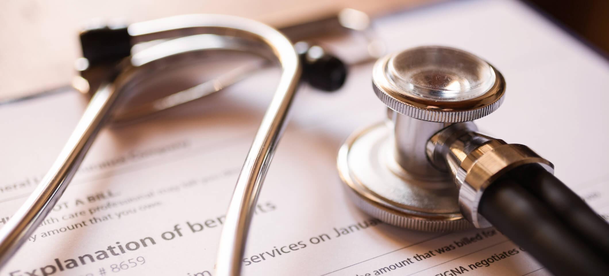 Stethoscope and medical billing documents depict RCM