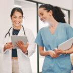 Physician and medical practice staff member read about how to calculate and improve patient no-show rate