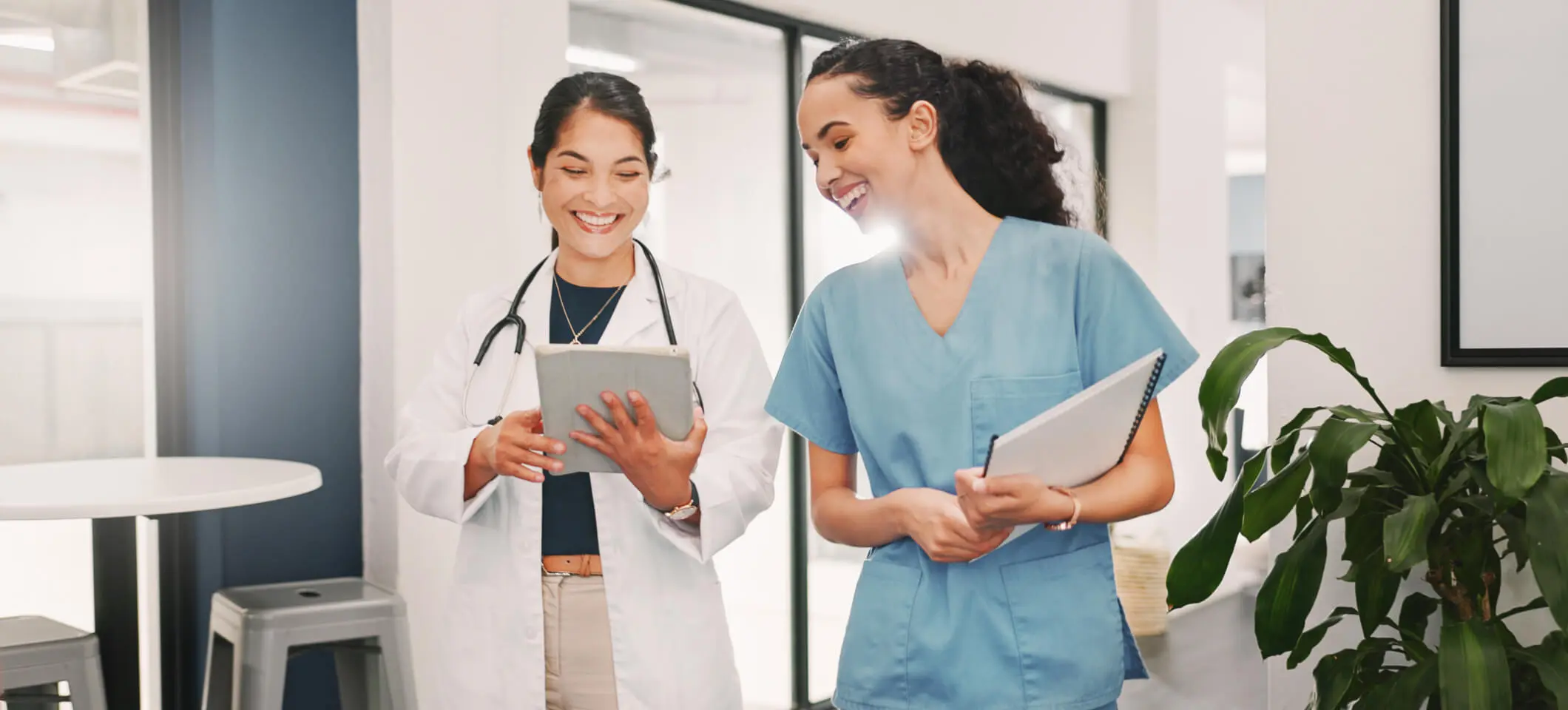 Physician and medical practice staff member read about how to calculate and improve patient no-show rate