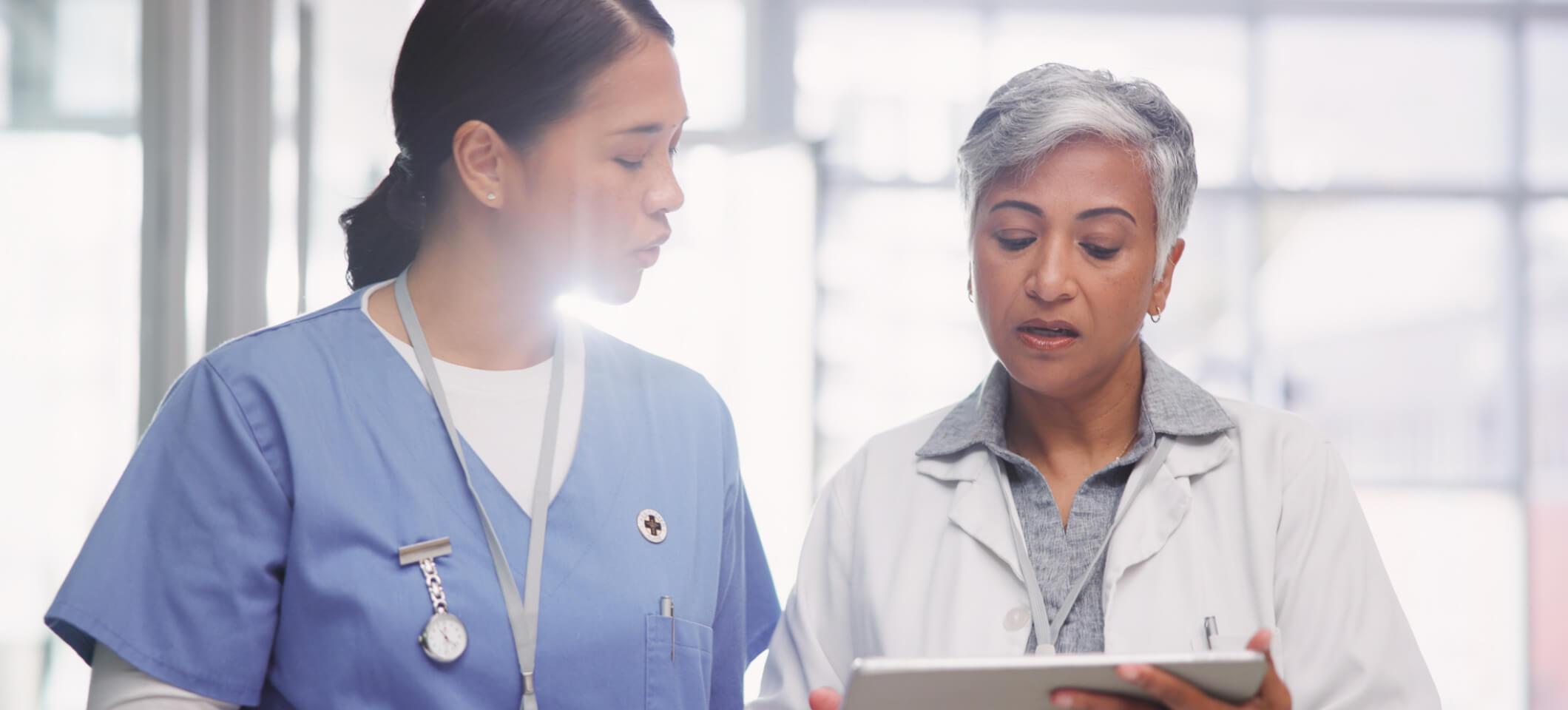 Medical staff collaborate on patient care, answering how does EHR improve efficiency