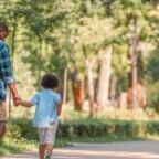 father and child following summer health tips