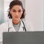 A doctor managing patient reviews with AI.