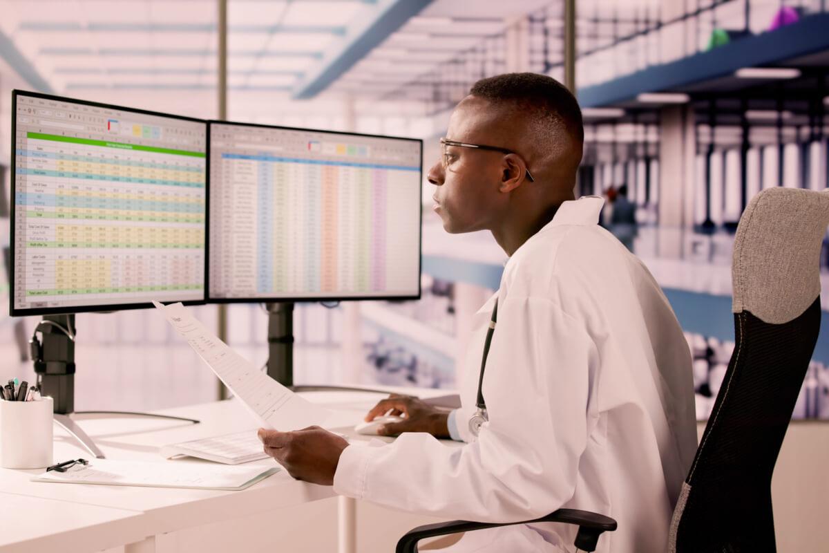 Billing professional demonstrates how to use AI in medical coding on computer